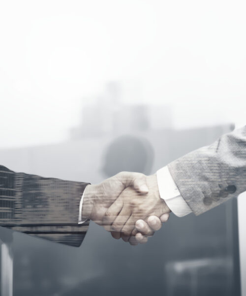 Business partners handshake international business.